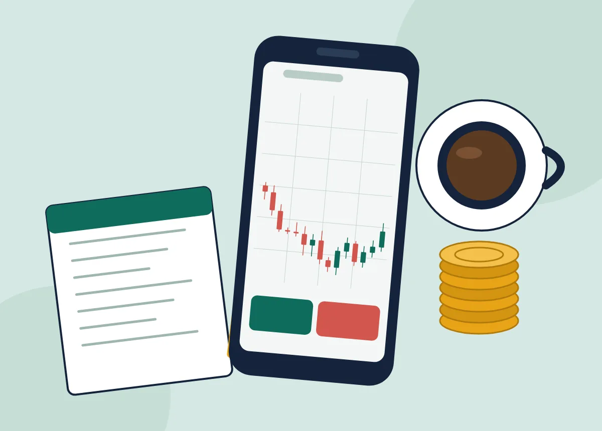 Smartphone showing a candlestick chart next to a coffee cup, notebook and coins on a desk